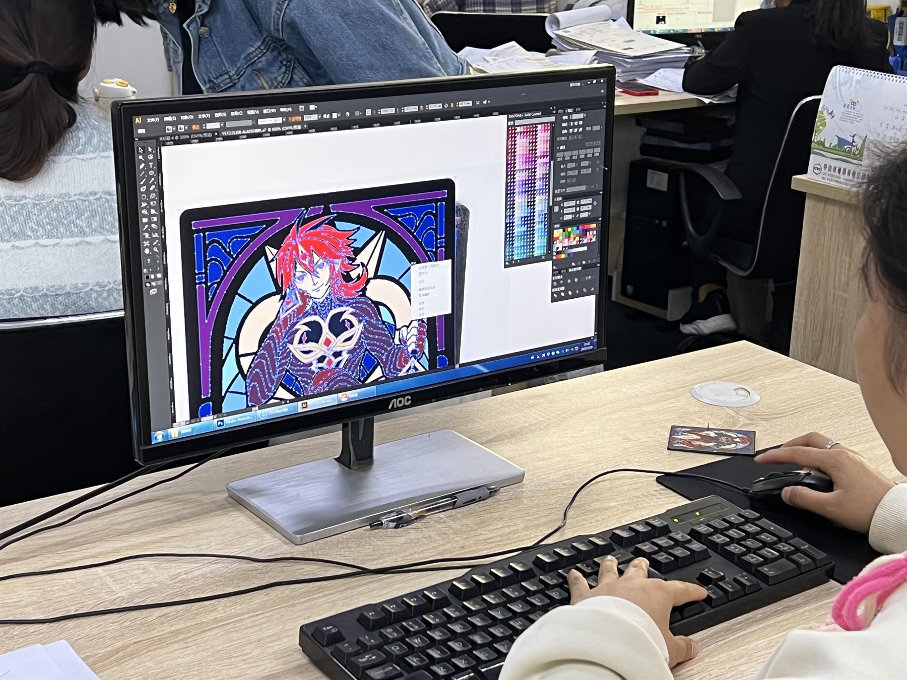 custom enamel pin artwork proofing in the factory design office