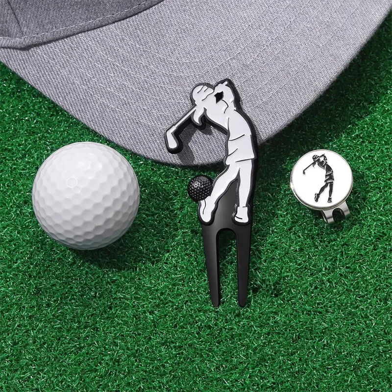golf divot tool and personalized ball marker beside a golf cap and ball