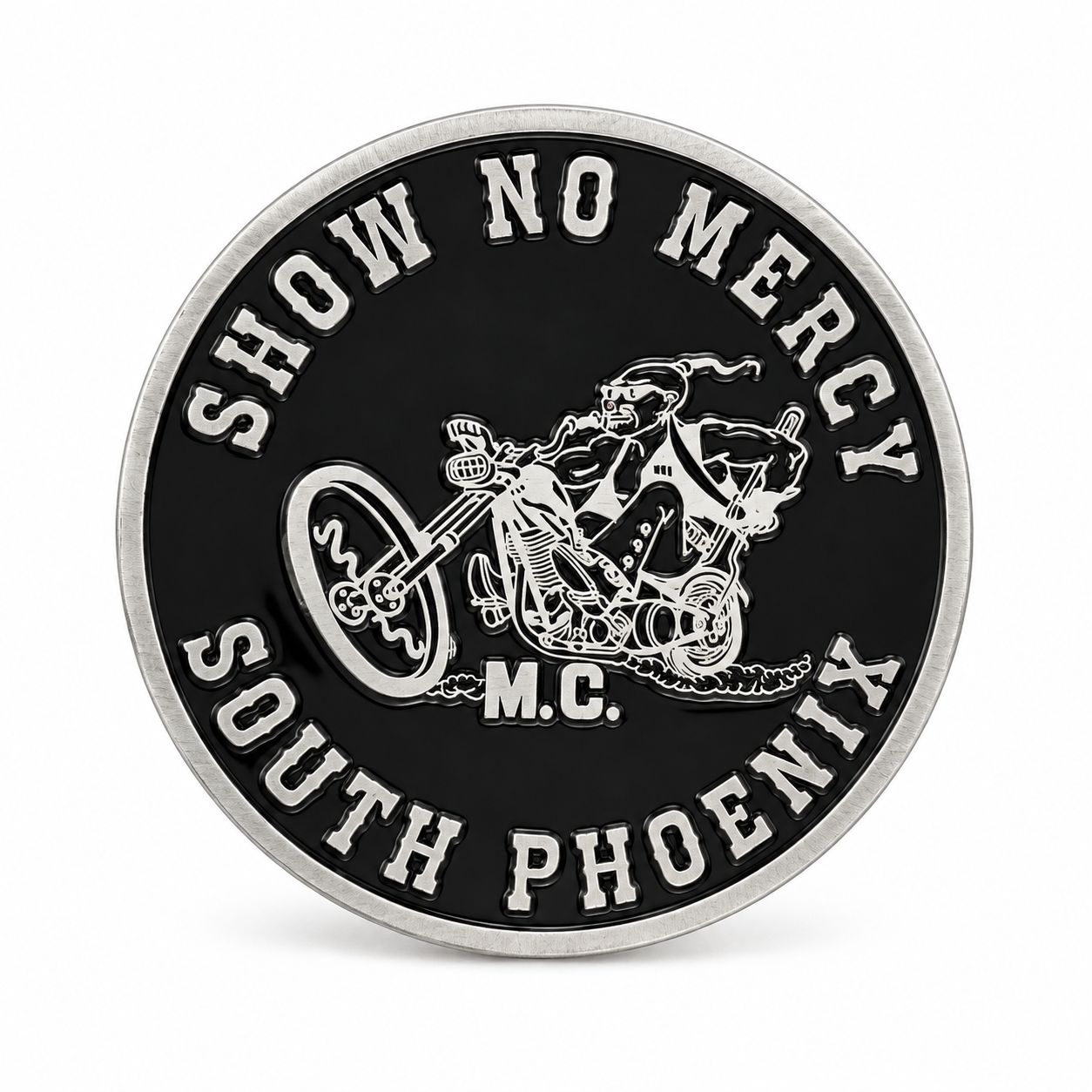 Finished round coin with a black face, silver-tone details and curved lettering