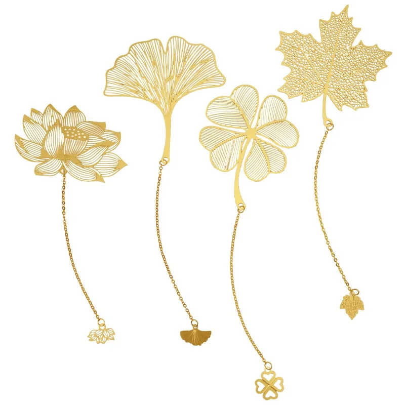 Four gold-tone metal bookmarks shaped like a lotus, ginkgo leaf, four-leaf clover and maple leaf with chains and small charms