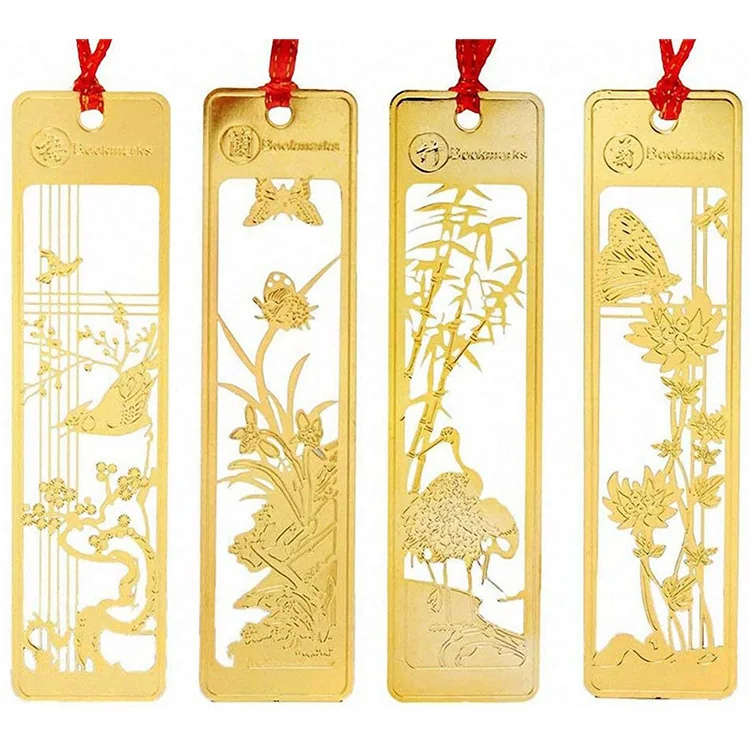 Four rectangular gold-tone metal bookmarks with intricate bird, bamboo and floral cutout designs and red hanging cords